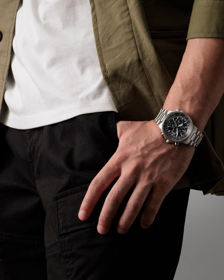 Citizen AT8300-58E Promaster watch on wrist showing stainless steel bracelet and black dial design