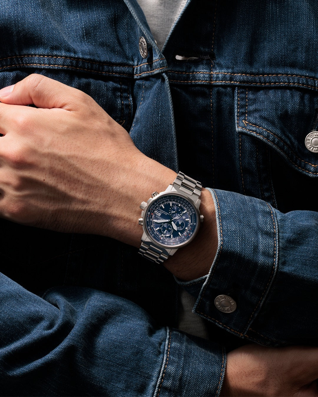 Citizen AT8300-58L Promaster watch on wrist showing stainless steel bracelet and blue dial design