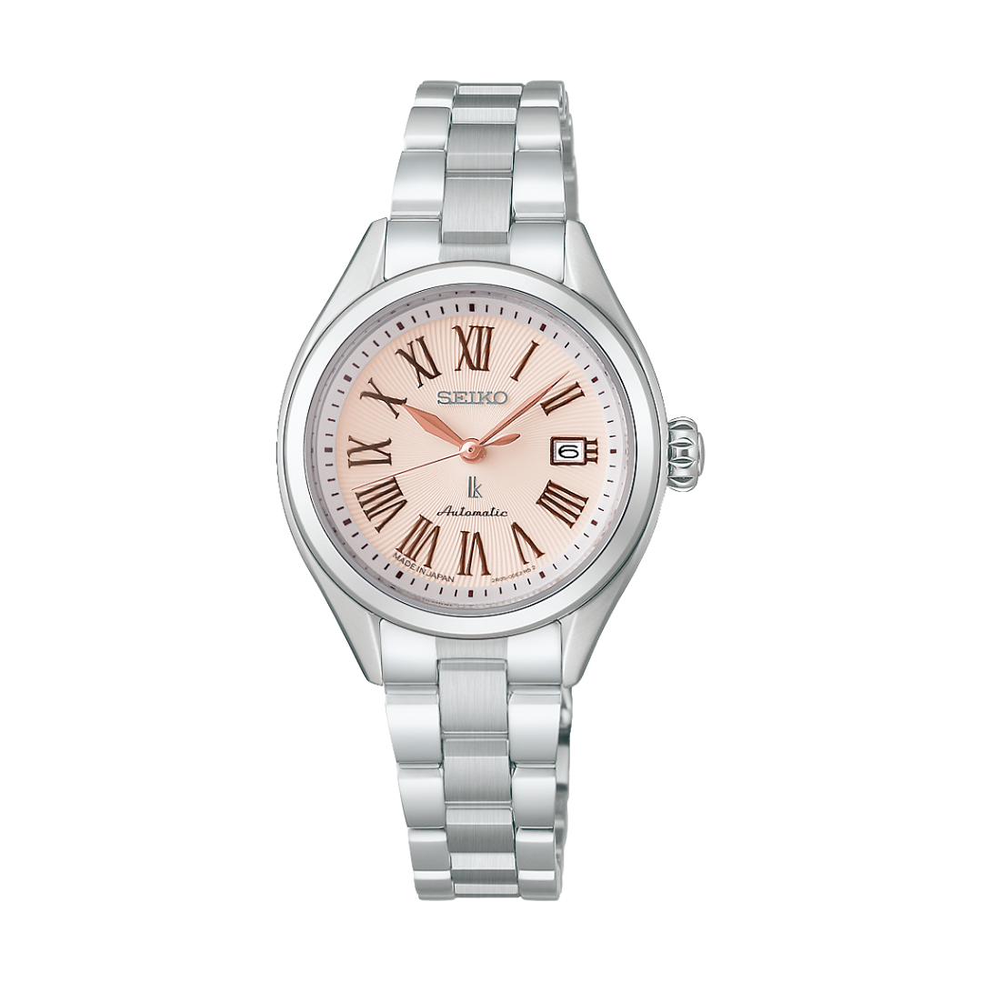 seiko lukia in 3 hands date with roman numerals in light pink dial and silver stainless steel automatic women watch 