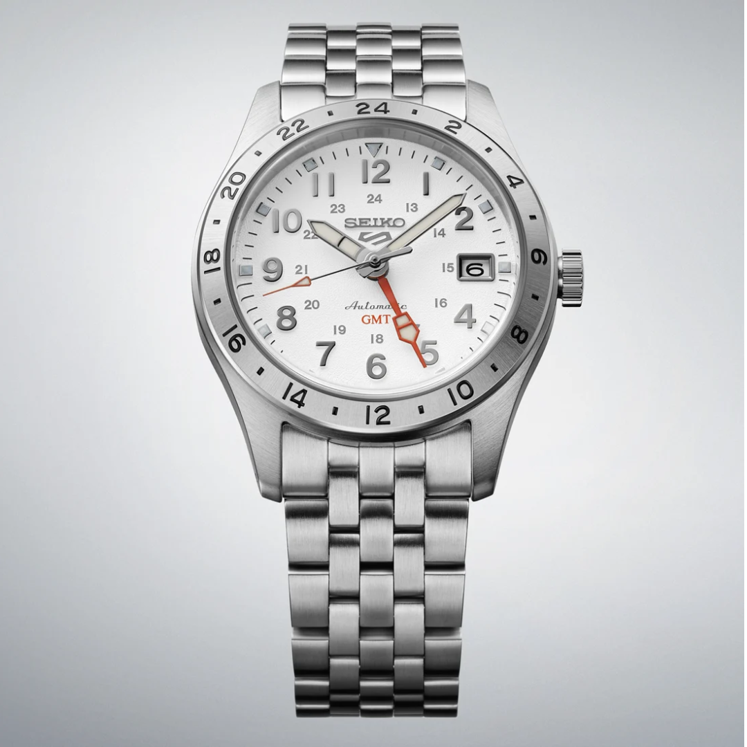 Seiko 5 Sports SSK059K1 Field GMT 39.4mm automatic watch — white textured dial with orange GMT hand, Lumibrite hands and indices, date display and stainless steel bracelet