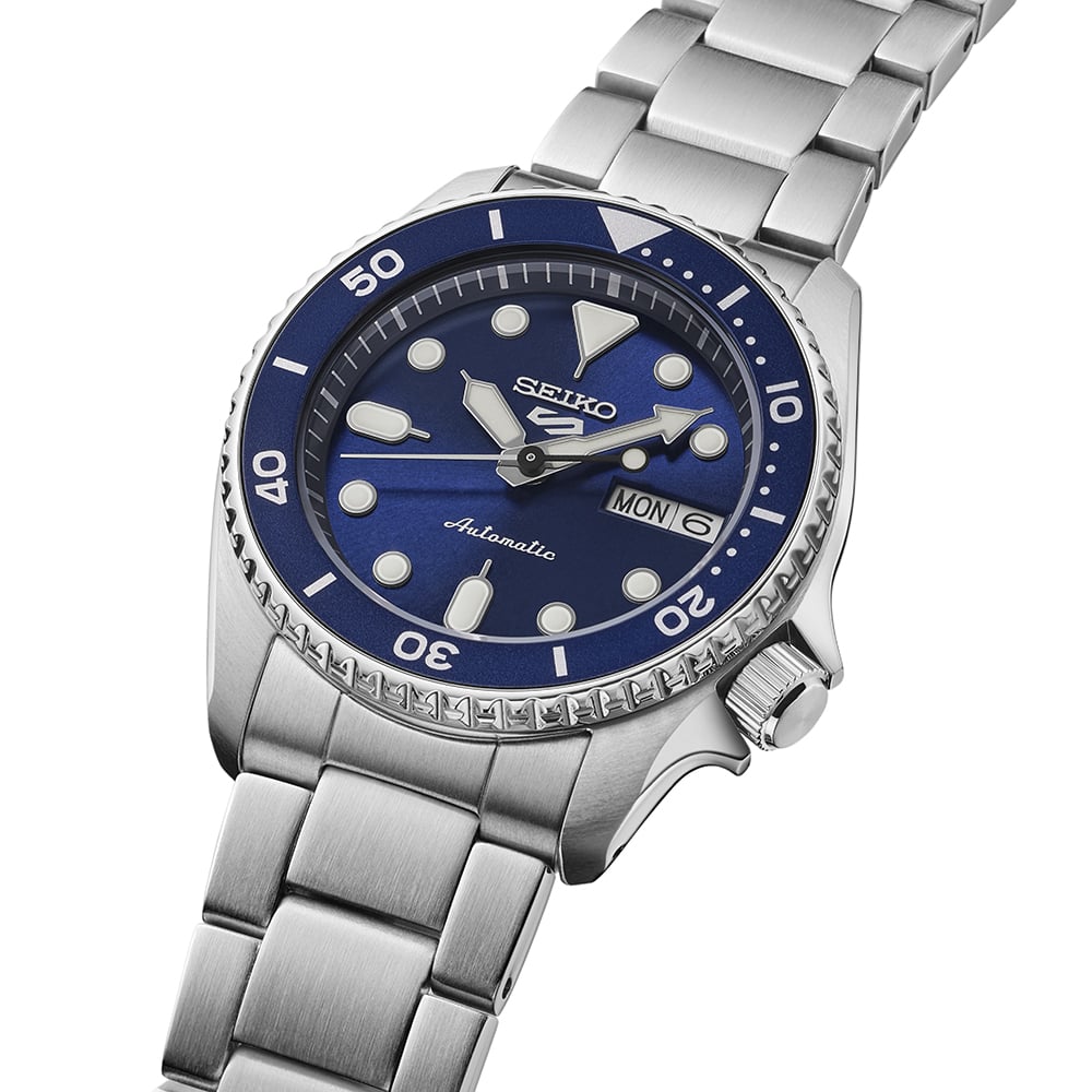 Seiko 5 Sports SRPL77K1 close-up showing blue dial with LumiBrite markers and unidirectional bezel