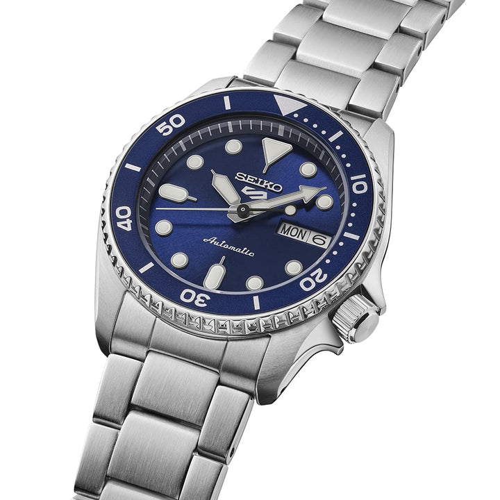 Seiko 5 Sports SRPL77K1 close-up showing blue dial with LumiBrite markers and unidirectional bezel