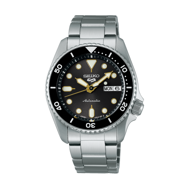 Seiko 5 Sports SRPL79K1 automatic watch with grey dial, gold accents, and 38mm SKX case