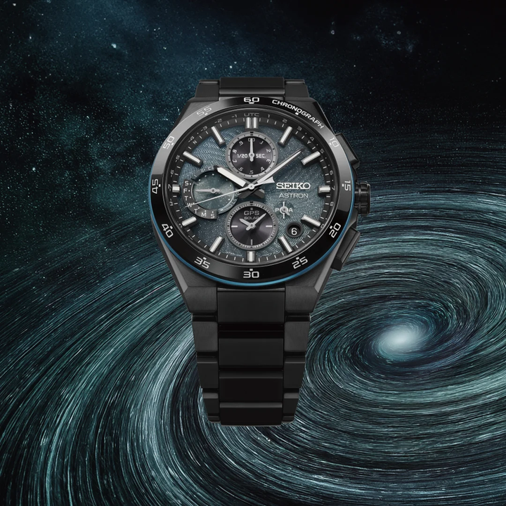 Seiko Astron SSH187J1 Spiral Galaxy GPS solar chronograph limited edition — dark turquoise blue glittered spiral galaxy dial, all-black super hard coated titanium case and bracelet, deep space spiral galaxy backdrop