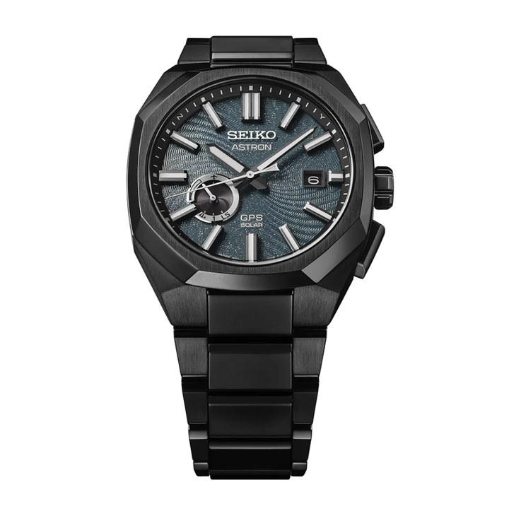 Seiko Astron SSJ039J1 Spiral Galaxy GPS solar limited edition — dark turquoise blue textured dial with spiral galaxy pattern and glittered star effect, all-black titanium case and bracelet, front view