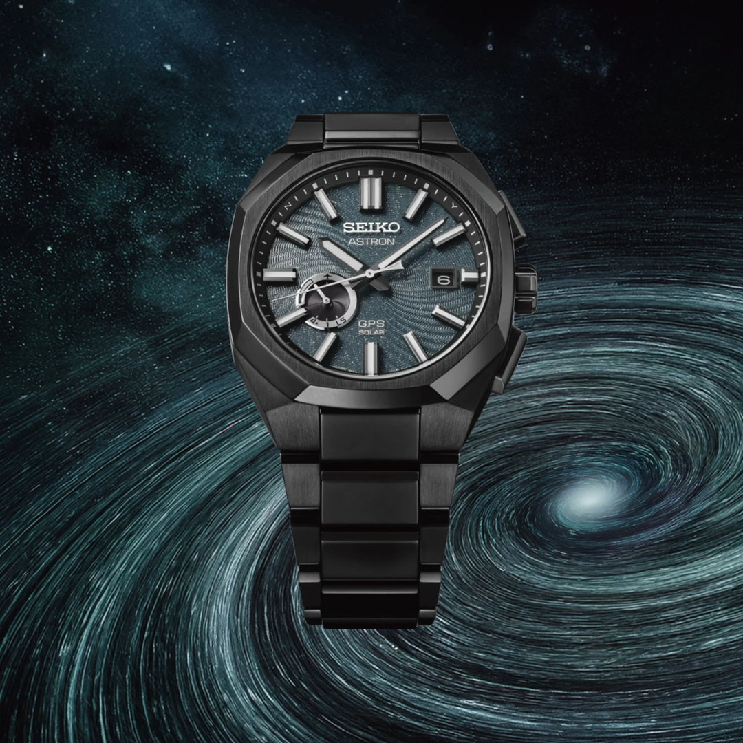 Seiko Astron SSJ039J1 Spiral Galaxy limited edition GPS solar — dark turquoise blue textured spiral galaxy dial, all-black super hard coated titanium case and bracelet, deep space spiral galaxy backdrop