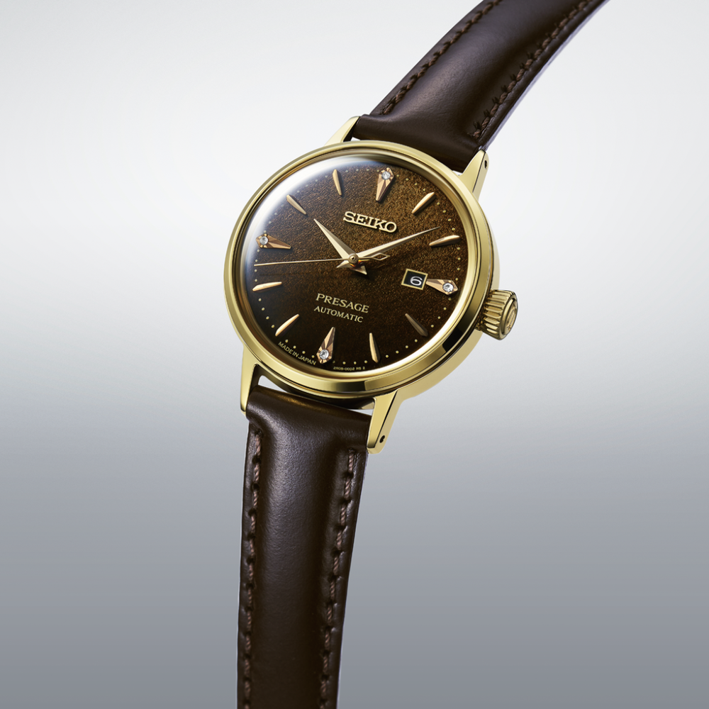 Seiko Presage SRE020J1 30.3mm automatic women's watch — brown textured dial with diamond accents, gold-tone case and crown, dark brown leather strap, 3/4 angle view