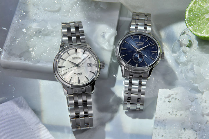 Seiko Presage Cocktail Time collection — silver dial SRPG23J1 and blue dial SSA347J1 automatic watches with stainless steel bracelets, styled on ice with lime