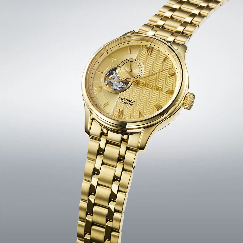 Seiko Presage SSA468J1 close-up showing gold dial with Roman numerals and dual-curved sapphire crystal