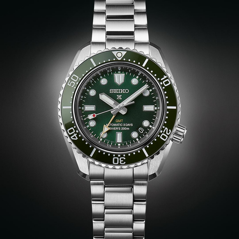 Seiko Prospex SPB381J1 green dial detail showing GMT hand and date display at 3 o'clock