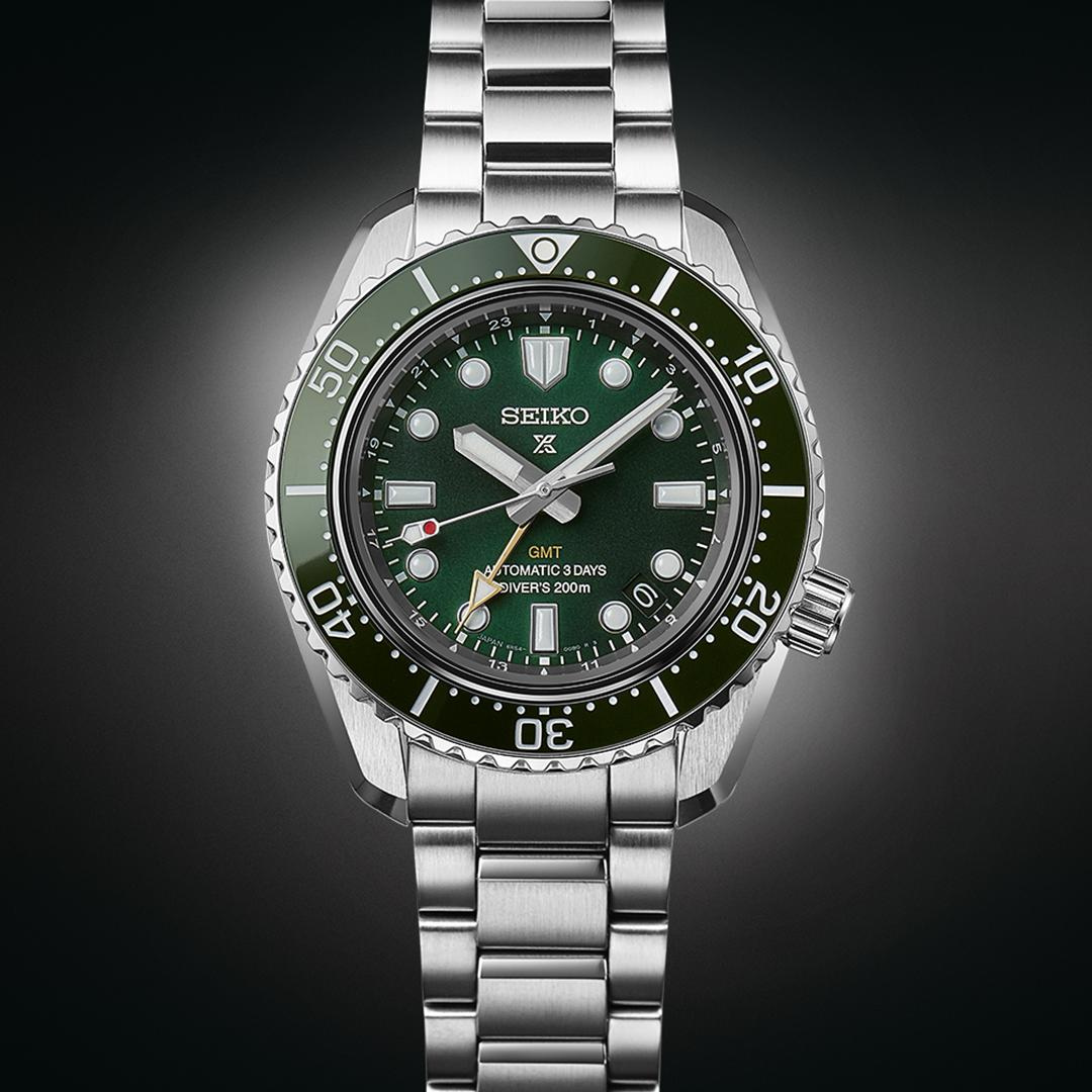 Seiko Prospex SPB381J1 green dial detail showing GMT hand and date display at 3 o&
