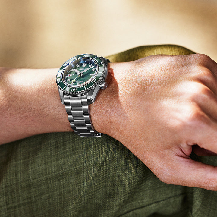 Seiko Prospex SPB381J1 GMT automatic diver on wrist showing green dial and bracelet