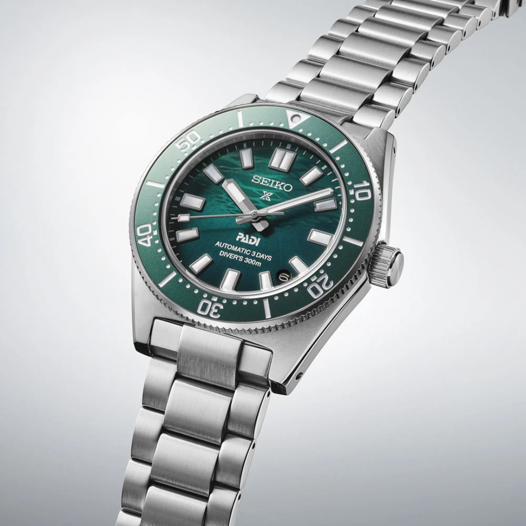 Seiko SPB501J1 PADI green dial detail with LumiBrite markers and date display at 3 o&