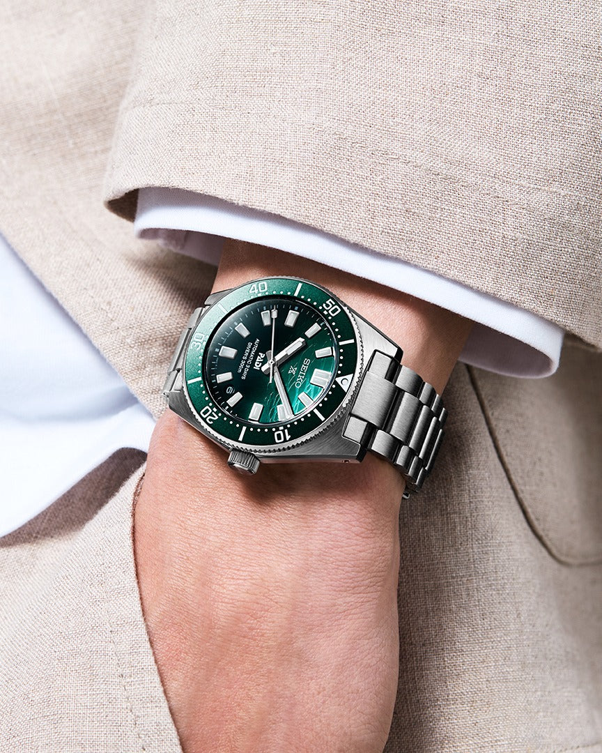 Seiko SPB501J1 PADI Heritage Diver on wrist with green dial and stainless steel bracelet