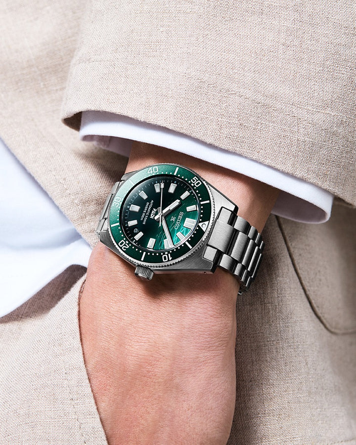 Seiko SPB501J1 PADI Heritage Diver on wrist with green dial and stainless steel bracelet