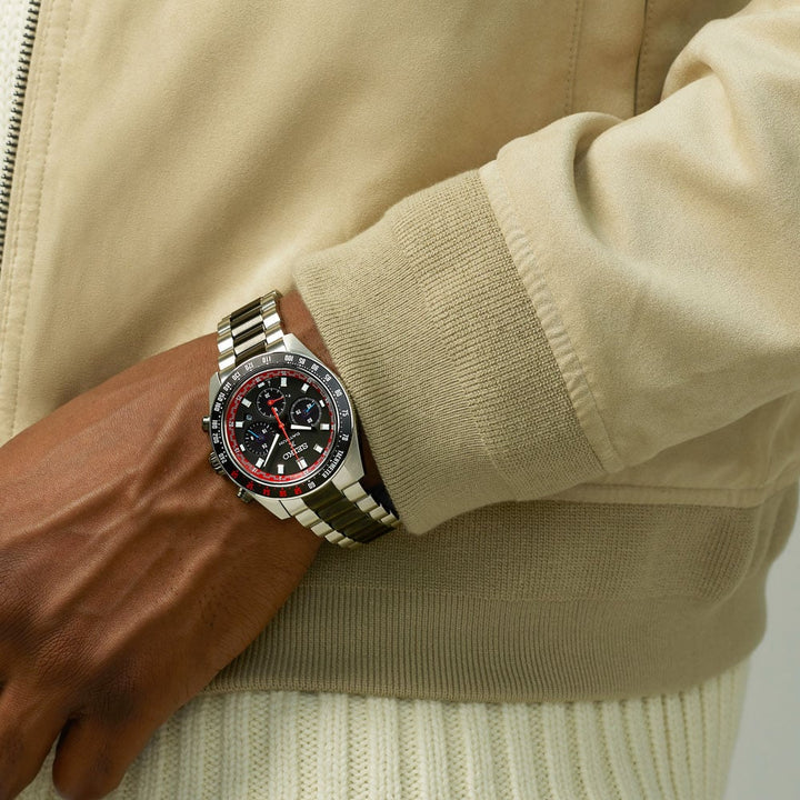 Seiko Prospex Speedtimer SSC957P1 Datsun 240Z limited edition worn on wrist — black dial with red accents and tachymeter bezel, stainless steel bracelet