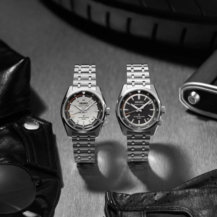 Seiko Prospex Speedtimer collection — white dial SPB513J1 and black dial SPB515J1 automatic watches with stainless steel bracelets, styled with motorcycle gear
