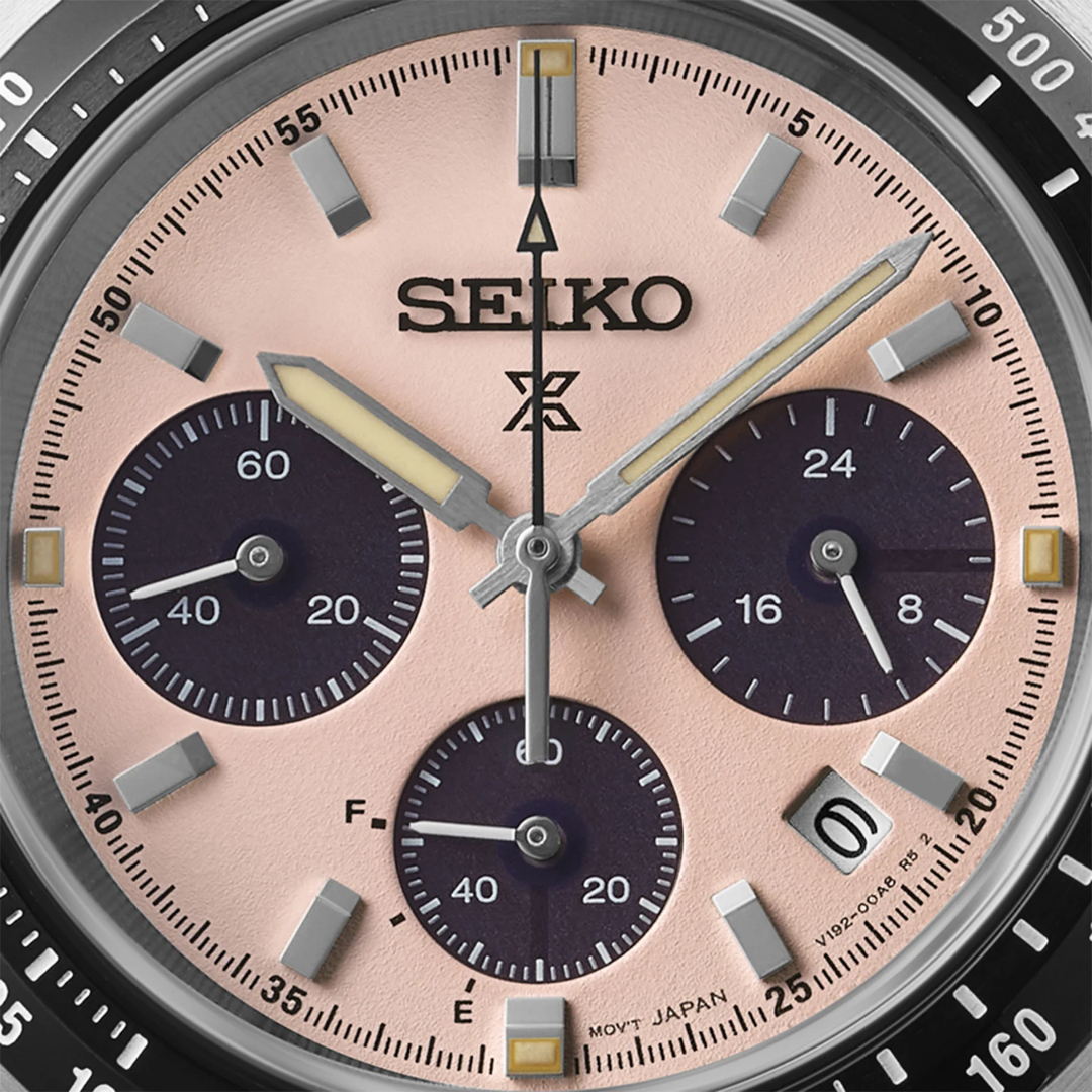 Seiko Prospex Speedtimer SSC963P1 dial close-up — pale pink textured dial with dark sub-dials, LumiBrite arrow hands, power reserve indicator and date window